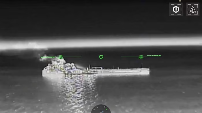 Thermal targeting-camera footage showing a Russian ship at sea at night amid intensified Ukrainian attacks in the Sea of Azov, with smoke or fire visible near the stern